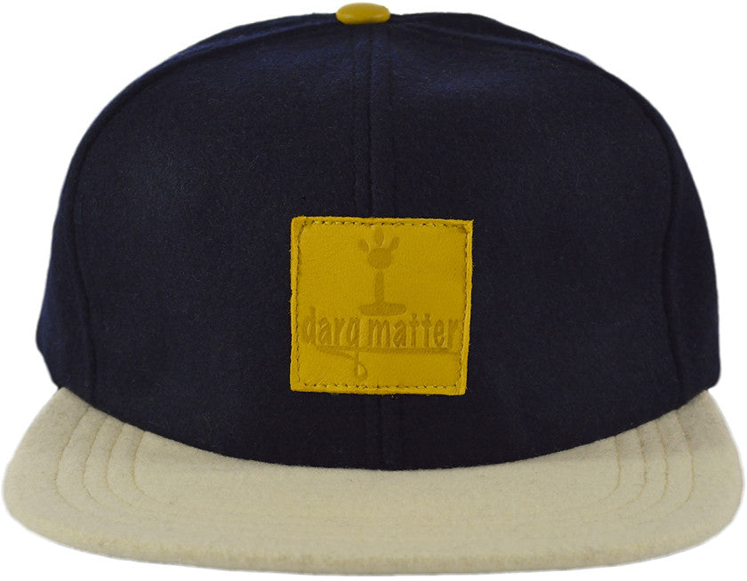 Strapback cap, Blue Dome, Cream color bill, Yellow leather logo patch on front, yellow leather button on dome, yellow leather back strap